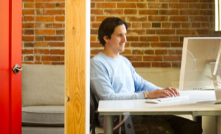 SilkStart CEO Shaun Jamieson working at his desk